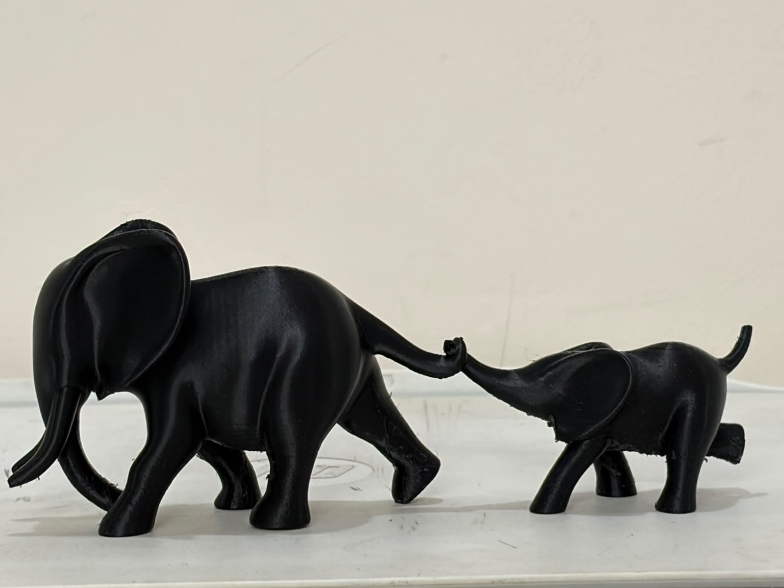 Our black 3D printed elephant and calf sculptures